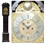 A carved oak longcase clock with arched brass dial inscribed 'Tho Wightman, George Yard,