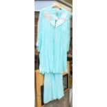 A 1970s pale blue chiffon silk sleeveless long dress with painted yolk with matching jacket with