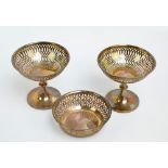 A pair of George V hallmarked silver loaded bonbon with pierced circular bowls,