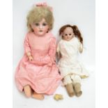 A Simon and Halbig bisque headed doll with open and close eyes, open mouth revealing four teeth,