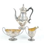 DANIEL & JOHN WELLBY; a late Victorian hallmarked silver three piece tea set,