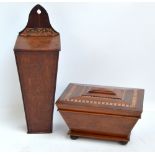 A 19th century mahogany sarcophagus tea caddy with inlaid banding,