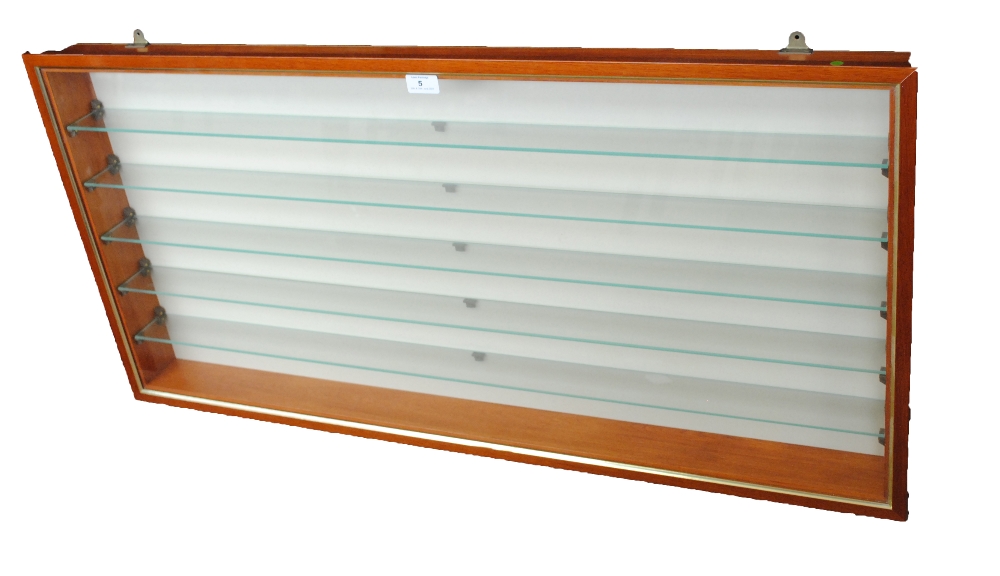 A collectors' cabinet with glass shelves and front, width 107cm, height 52.5cm, depth 8.5cm.