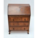 A 1930s/40s walnut bureau, width 72cm.