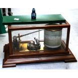 A mahogany and glass-cased barograph.