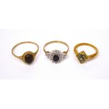 Three 9ct gold ladies' dress rings; one set with oval red cabochon stone, size X,