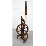 A 19th century turned beech spinning wheel.