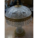 A mid-20th century brass-mounted cut glass table lamp with mushroom-form shade, height approx 45cm.