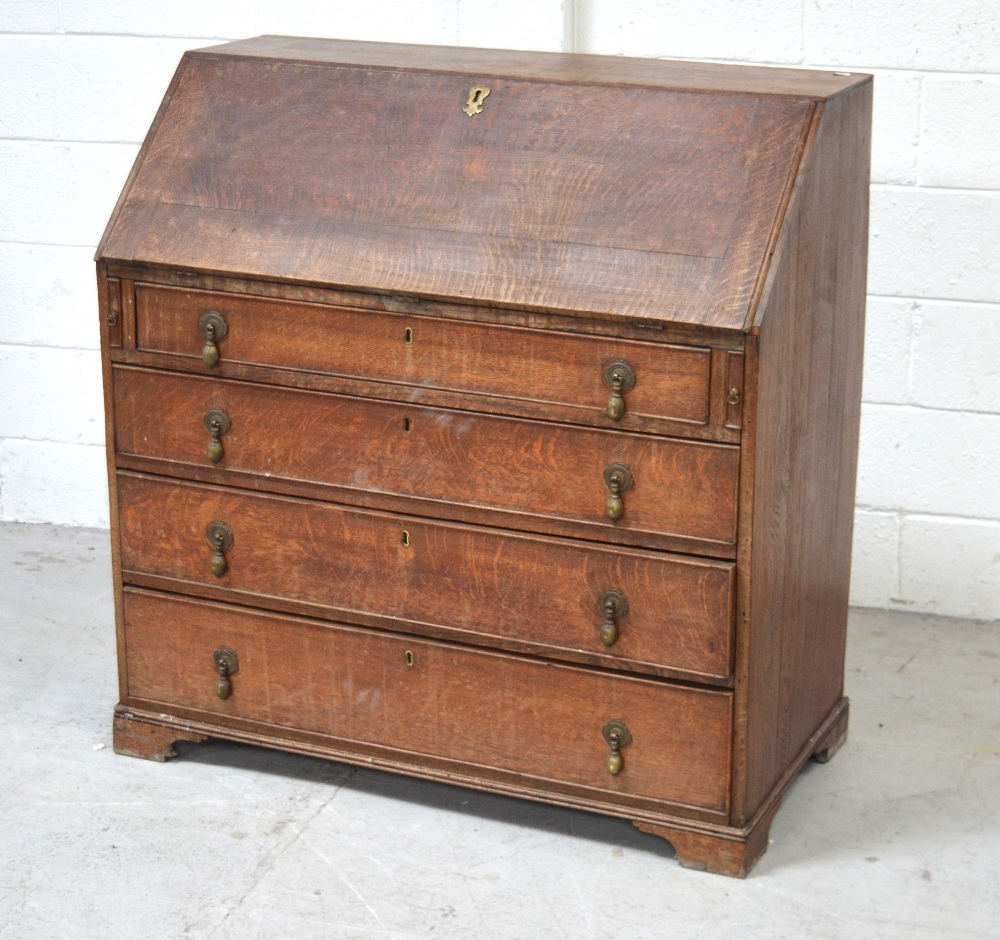 An oak George III fall-front bureau, fitted desk above four long drawers, width approx 102cm,