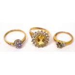 A 9ct gold dress ring with central pale amber-coloured stone and white stone surround, size S,