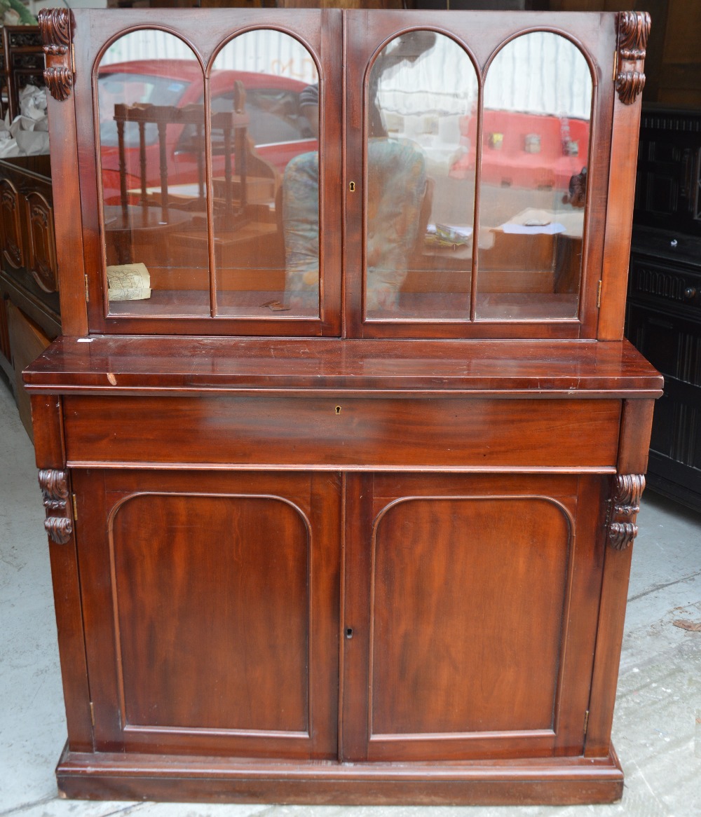 A Victorian flame mahogany two-door glazed bookcase with adjustable shelves,