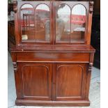 A Victorian flame mahogany two-door glazed bookcase with adjustable shelves,