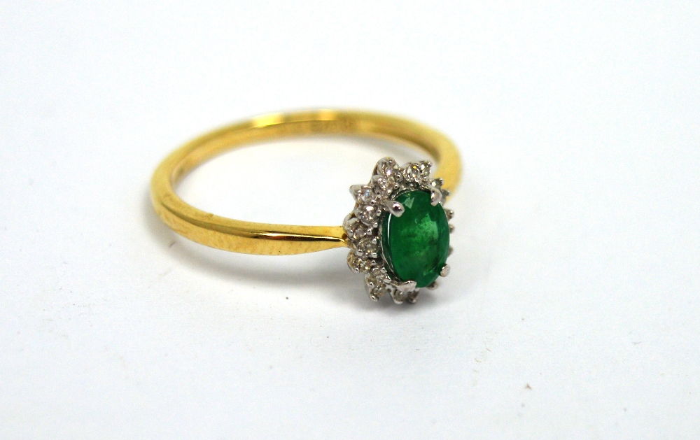 A 9ct yellow gold oval-cut emerald ring surrounded by melee diamonds, size L 1/2, approx 1.6g. - Image 2 of 2