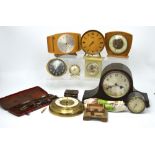 A quantity of mantel clocks to include a 1950s Kienzle mantel clock on tripod feet,