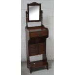 A c1900 mahogany tall mirror-back pot cupboard with single drawer over lower two-door cupboard on