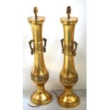 A pair of brass Chinese table lamps with twin handle decoration, height approx 80cm.