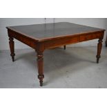 An Edwardian library oak table with leather insert,