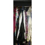 Approximately thirteen various-coloured taffeta full-length skirts, taffeta waist slips,