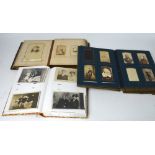 A Victorian leather-bound photograph album containing many cabinet cards and photographs from