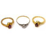 Three 9ct gold ladies' dress rings; one with central white stone,