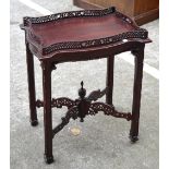 A reproduction mahogany butler's tray with pierced frieze edging and four pierced central