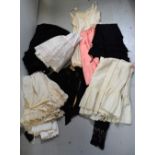 A quantity of Edwardian petticoats and later slips,
