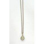 An 18ct white gold halo-set pear diamond pendant,