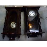 A mahogany-cased Vienna-style wall clock, enamel dial set with Roman numerals,