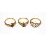 Three 9ct gold ladies' dress rings to include one set with amber-coloured pear-shaped central stone