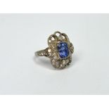 A 14ct white gold Art Nouveau style ring with central cushion-cut sapphire approx 1.