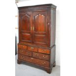 A George III oak livery cupboard with pair of panelled doors above six-drawer base on bracket feet,