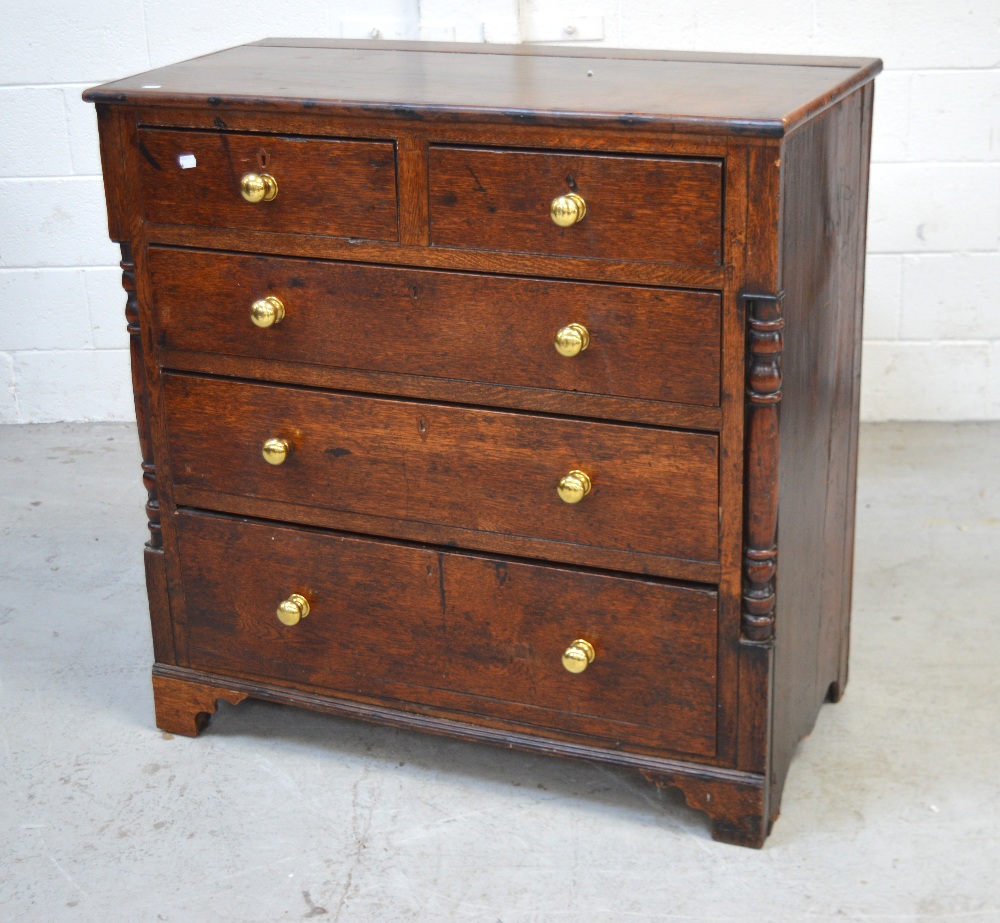 A 19th century oak chest of two short and three long drawers on bracket feet, width 100cm.