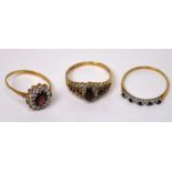 Three 9ct gold ladies' dress rings; a half-eternity ring set with small blue and white stones,