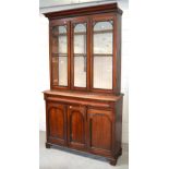 A Victorian bookcase, top section with two glazed doors and central glazed panel,