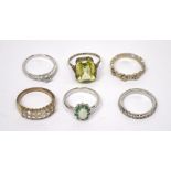 Six silver and white metal rings set with various stones to include large rectangular citrine