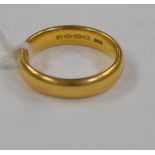 A 22ct yellow gold ladies' wedding band, size N 1/2, approx 7.4g.