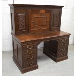 A large early 20th century oak kneehole bureau,