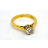 An 18ct yellow gold diamond solitaire ring, the round cut stone approx 0.