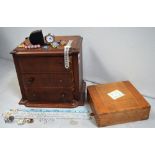 A mahogany three-drawer jewellery cabinet with canted corners, a marquetry inlaid box,