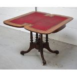 A 19th century mahogany fold-over games table on turned tapering supports to quatrefoil carves base,