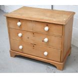 An Edwardian pine three-drawer chest of drawers on bracket supports, approx height 74cm,
