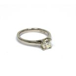 A platinum four claw-set brilliant-cut solitaire diamond ring, approx 0.