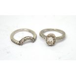 A platinum and diamond engagement ring and a matching handmade platinum and diamond wedding band