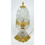 A mid-20th century brass-mounted cut glass table lamp with mushroom-form shade, height approx 42cm.