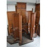 A large late Victorian Gothic revival oak confessional box with canopy and panelling.