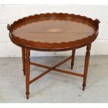 A marquetry inlaid mahogany butler's table on four legs with cross stretcher, length 72cm.