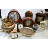 A mixed quantity of clocks to include a leather John Moor & Son, Clerkenwell bedside clock,