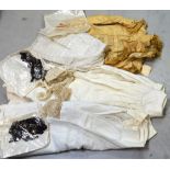 A quantity of Edwardian linen with lace trim to include petticoats, Victorian skirts,