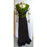 A 19th century black and chartreuse silk and velvet evening skirt and bodice, net overlay to both,