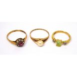 Three 9ct gold ladies' dress rings; one set with central pearl,